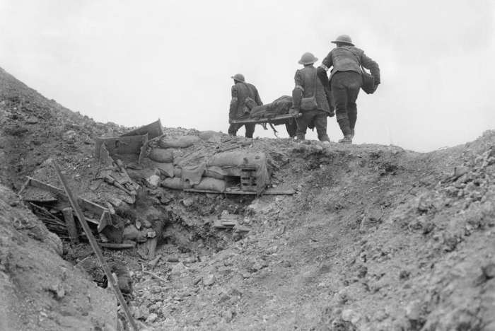 Stretcher bearers carry a wounded soldier during the Battle of the Somme in World War I. France, September 1916. IWM (Q 1332)