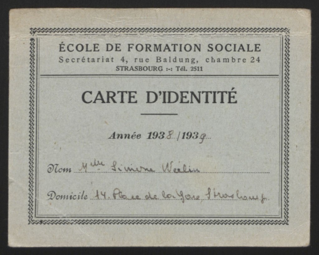 Light blue paper student card in French with text in black ink.