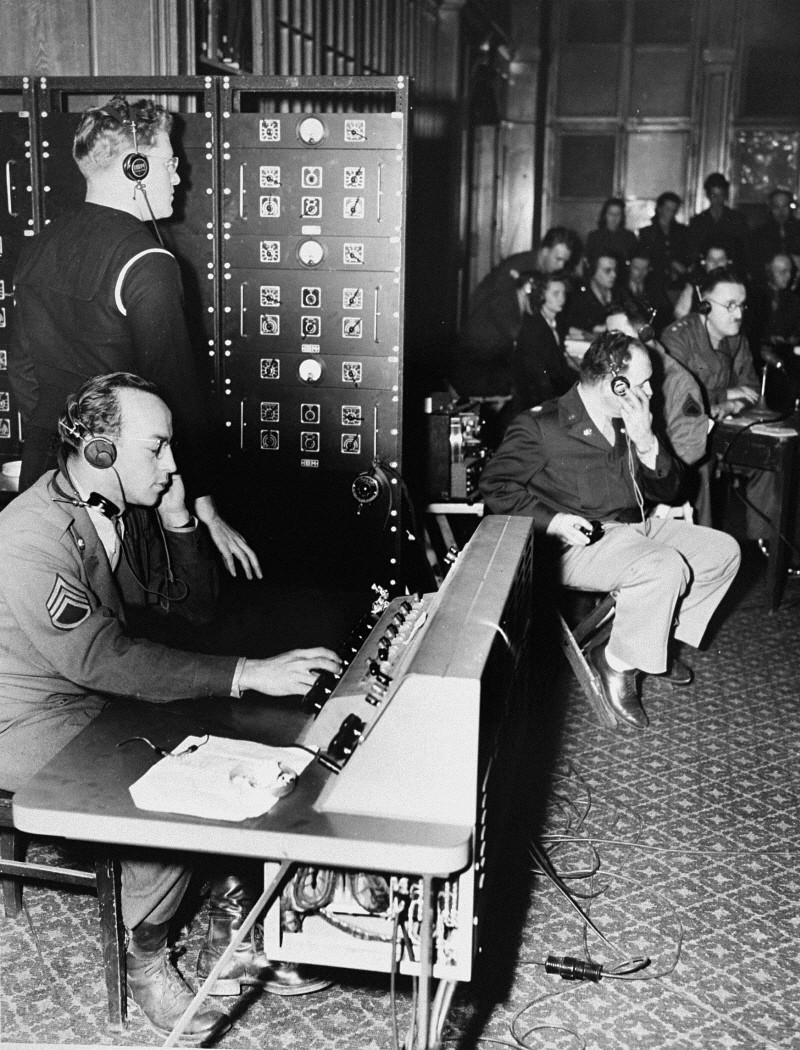 English, French, Russian, and German were official languages of the Nuremberg trials. Translators provided simultaneous translations of the proceedings. Here, they route translations through a switchboard to participants in the trial. Nuremberg, Germany, November 1945.