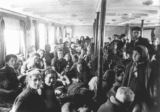 Thracian Jews crowded into an interior room of a deportation ship just before it left the port of Lom.