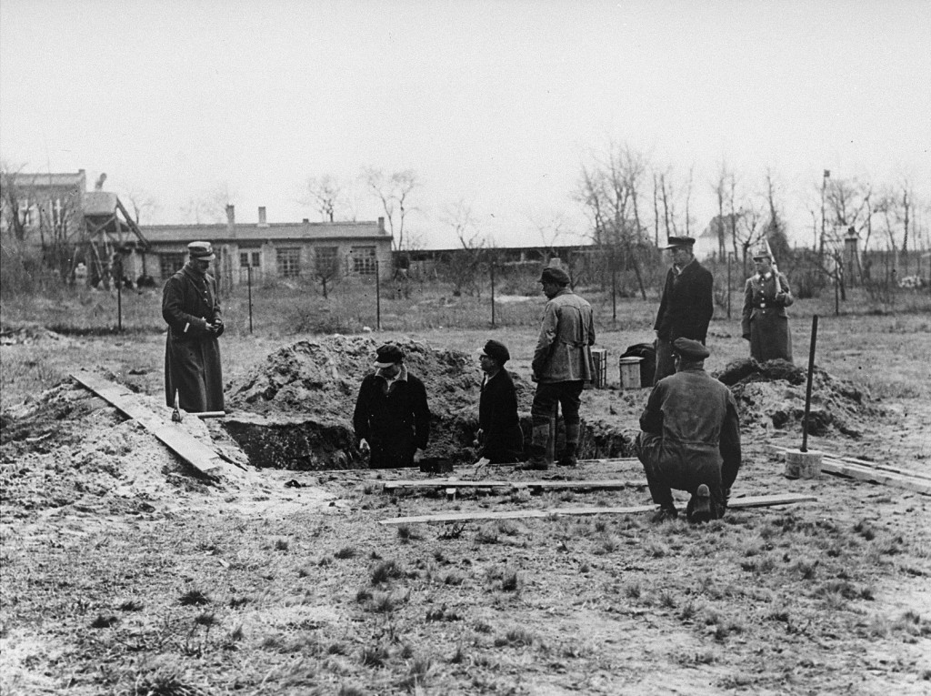 Prisoners at forced labor under SS and police guard in the Oranienburg concentration camp.