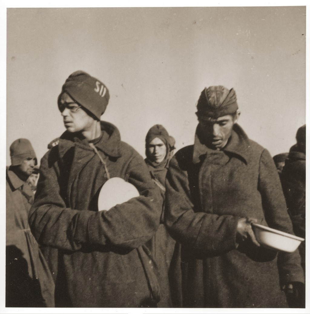 Soviet prisoners of war wait for food in Stalag (prison camp) 8C. [LCID: 50193]
