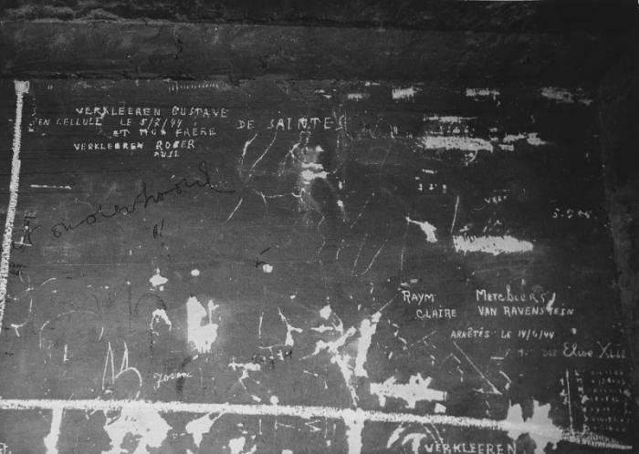 Prisoner names scratched on the wall of the Breendonck internment camp.