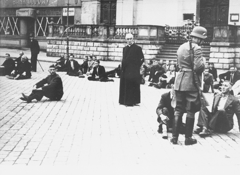 German soldiers hold Poles, including Polish clerics, hostage.