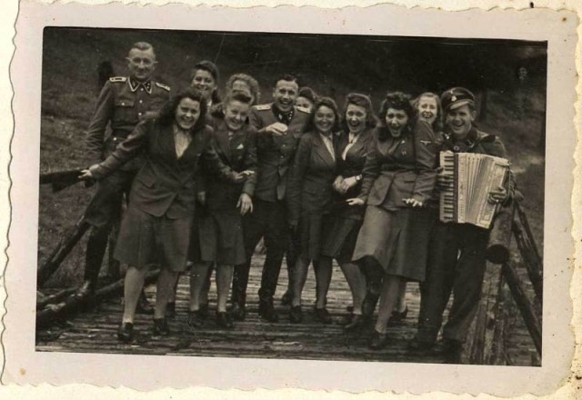 The SS female auxiliaries (Helferinnen) run down a ramp in Solahütte to the music of an accordion.