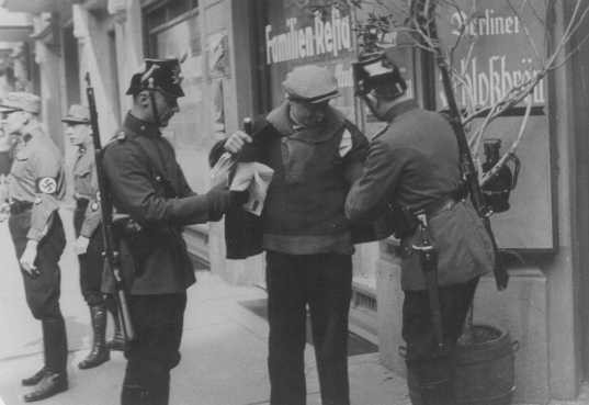 Police search in Berlin. Germany, 1933.