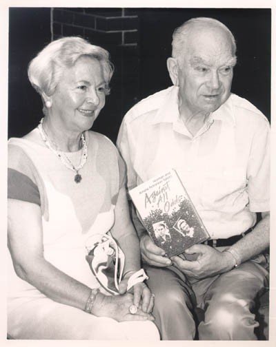June 6, 1991, photograph showing Amalie and Norman with a copy of their book, Against All Odds. [LCID: sals25]