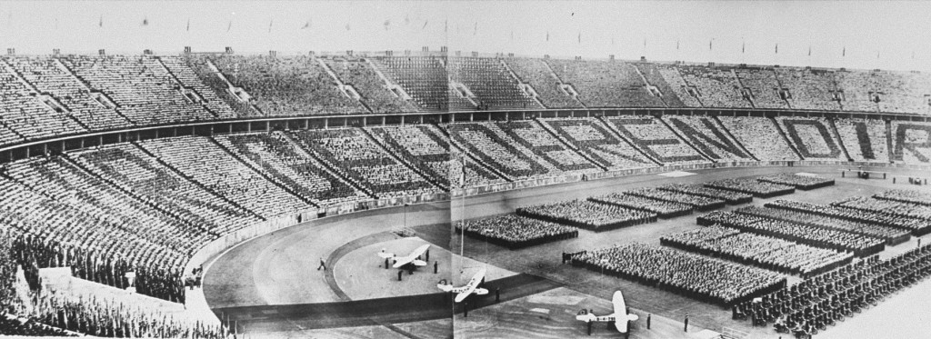 At a ceremony during the 1936 Olympic Games, German spectators spell out the phrase, directed at Adolf Hitler, "Wir gehoeren Dir" ... [LCID: 81610]