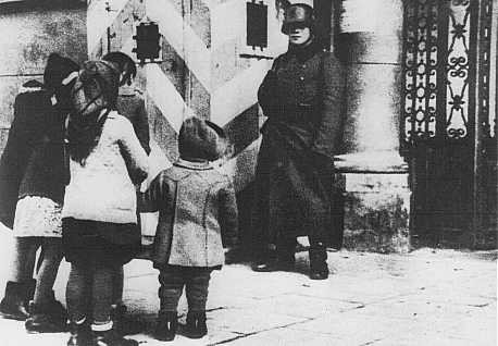 <p>Polish children look for their parents at the Gestapo (German Secret State Police) office in Warsaw. Poland, wartime.</p>