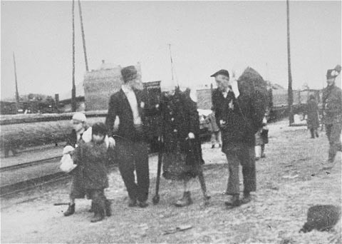 Jews bound for the rail station during deportation action from Sighet. [LCID: 10471]