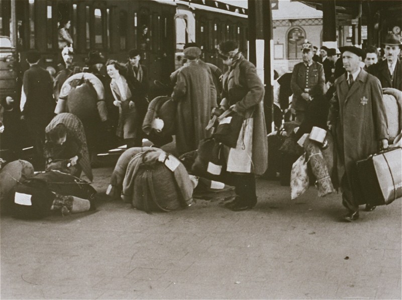 German Jews board a train that will deport them to Theresienstadt.