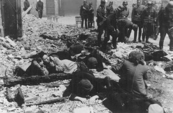 German soldiers capture Jews hiding in a bunker during the Warsaw ghetto uprising.