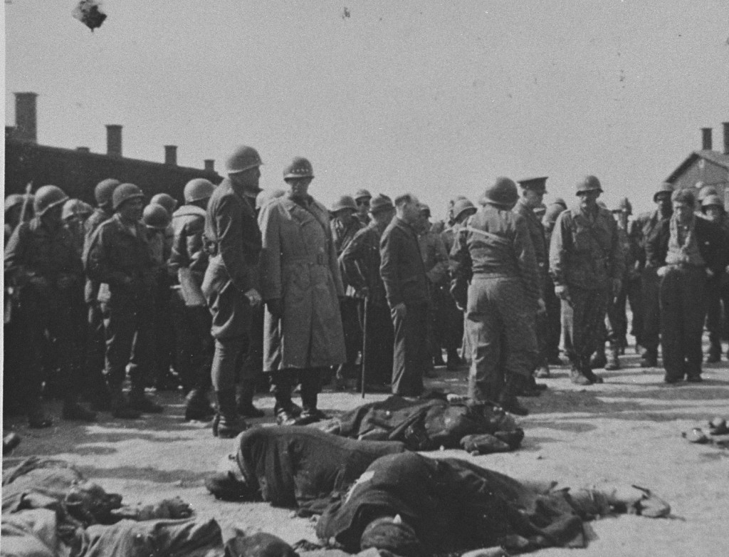 Generals Eisenhower, Patton, and Bradley view corpses of inmates at Ohrdruf, a subcamp of Buchenwald. [LCID: 10315]