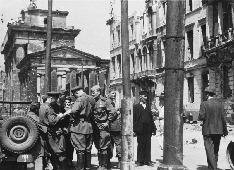 Soviet soldiers in a street in the Soviet occupation zone of Berlin following the defeat of Germany. [LCID: 04814]