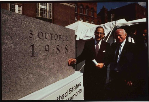 Benjamin Meed (right) and Harvey Meyerhoff stand next to the cornerstone for the United States Holocaust Memorial Museum.