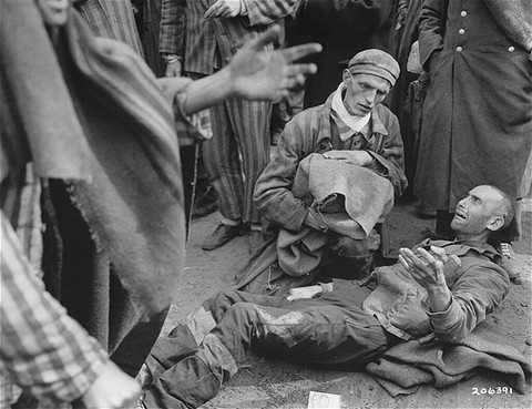 Survivors waiting for to be evacuated from the Wöbbelin concentration camp to receive medical attention at a field hospital. [LCID: 10585]