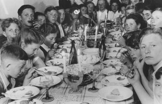Passover seder for children in the Landsberg displaced persons camp. Germany, April 15, 1946. [Please contact Beth Hatefutsoth for copies of this photograph.]