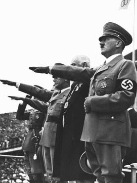 Adolf Hitler salutes the Olympic flag at the opening of the Olympic Games in Berlin.