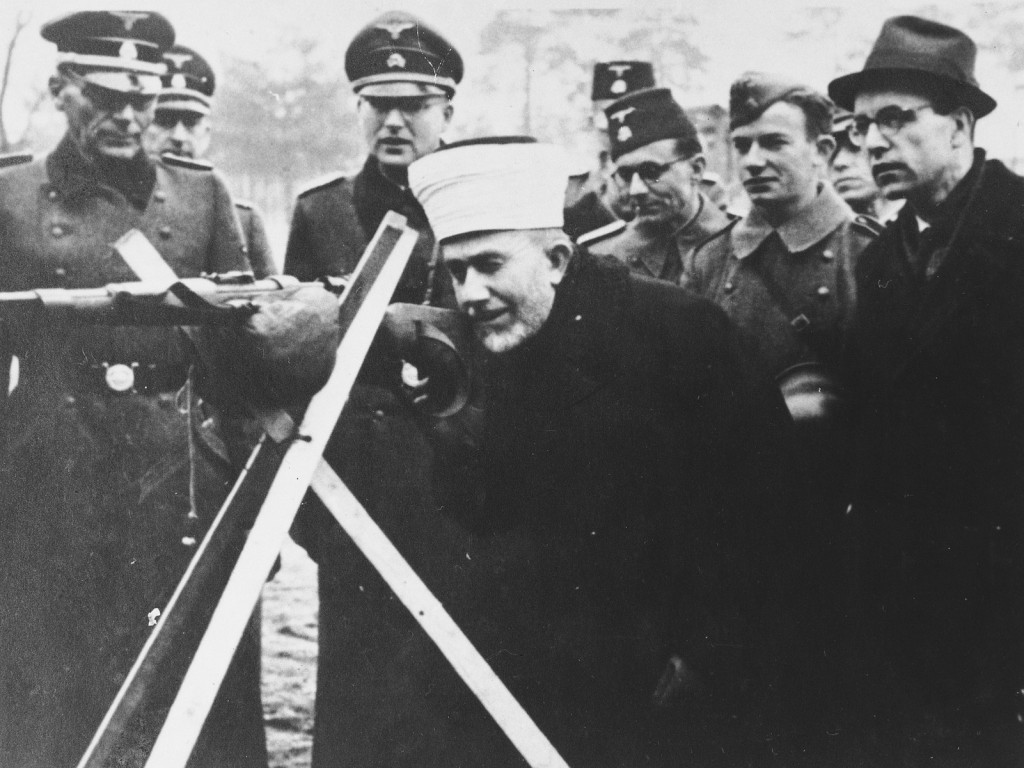 Hajj Amin al-Husayni in the company of German SS and Bosnian members of the Waffen-SS during an official visit to Bosnia, ca.