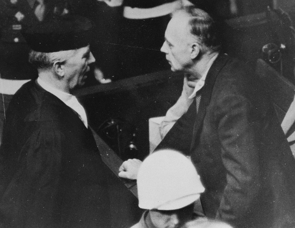 Joachim von Ribbentrop (Foreign Minister of Germany from 1938 to 1945) speaks with his lawyer, Dr. [LCID: 08527]
