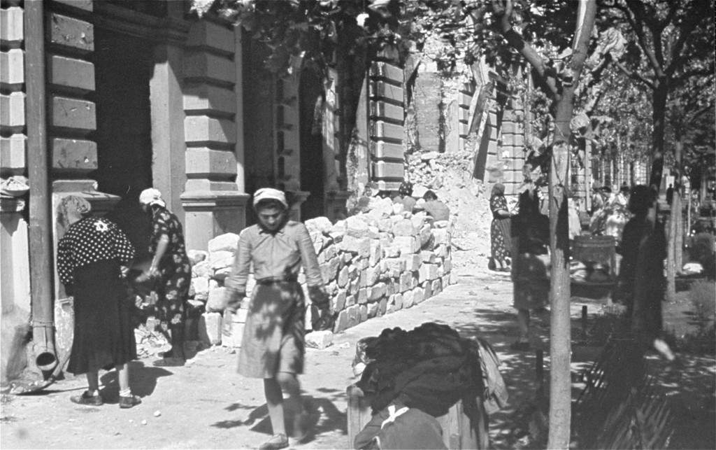 Jewish women at forced labor in the process of clearing rubble from the main street. [LCID: 03330]