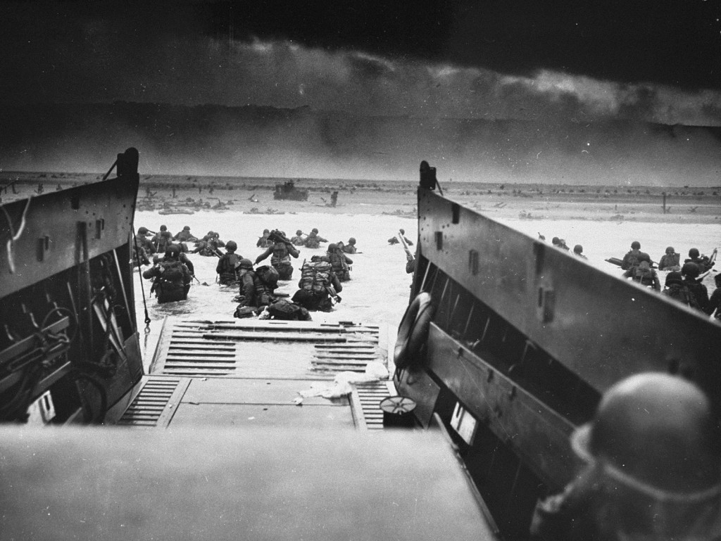 US troops wade ashore at Normandy on D-Day, the beginning of the Allied invasion of France to establish a second front against German ...