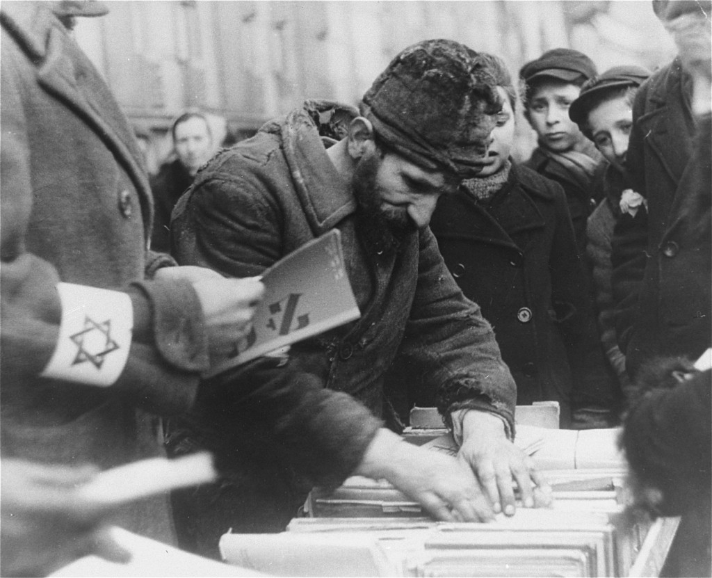 Street vendor sells old Hebrew books. Warsaw ghetto, Poland, February 1941. [LCID: 5324]