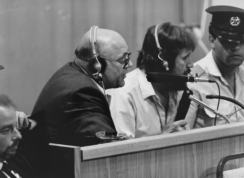 Defendant John Demjanjuk comments on documents being viewed on a large screen in court.