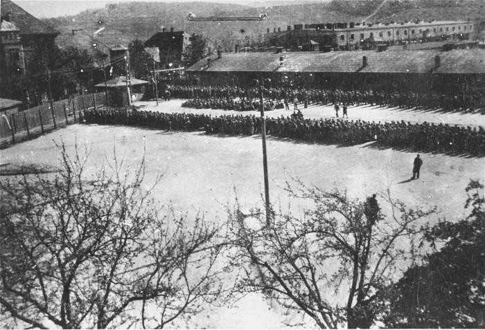 Newly arrived prisoners are assembled in the Appellplatz (roll call area) at the Melk camp, a subcamp of Mauthausen in Austria. 1944–45.