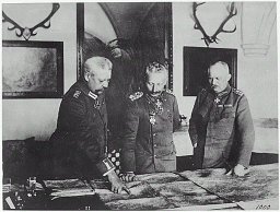 Pictured from left to right: Field Marshal Paul von Hindenburg, Kaiser Wilhelm II, and General Erich Ludendorff study maps during World War I. January 1917.