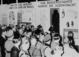 Nazi officials attend the opening of "Der ewige Jude" (The Eternal Jew), an antisemitic exhibition in Munich. [LCID: 44201]