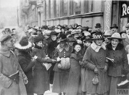 A crowd stands outside of a polling center during the German national election in January 1919. This was the first election held under the Weimar Republic, as well as the first election in which women had the legal right to vote in Germany. © IWM Q 110868