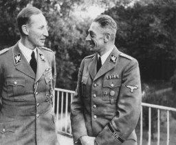  Reinhard Heydrich (left), Nazi governor of Bohemia and Moravia, with Karl Hermann Frank, his deputy. [LCID: 76579]