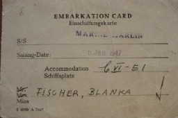 The American Jewish Joint Distribution Committee helped to locate relatives of Blanka's who lived in the United States. Blanka crossed the Atlantic Ocean in the winter on the SS Marine Marlin, a troop transporter. The trip took over two weeks during storms and rough seas. The ship was damaged, and Blanka, along with the other refugees traveling in the lowest quarters, had to walk in water for days.
This photograph shows Blanka's embarkation card for the SS Marine Marlin, with a sailing date in January 1947. 