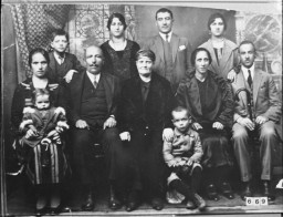 Portrait of an unidentified family, eight adults and three children, in Bitola. [LCID: 92842]