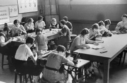 Girls in a sewing class at the Adas Israel school, maintained by the German Jewish community. [LCID: 76818]