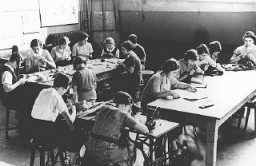 Girls in a sewing class at the Adas Israel school, maintained by the German Jewish community. Berlin, Germany, 1930s.