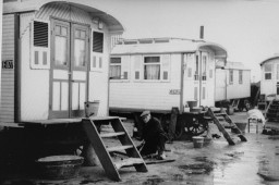 A man works outside his family's dwelling in a Roma (Gypsy) encampment in the city of Haarlem. [LCID: 07872]