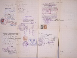 A Lithuanian safe conduct pass bearing a stamp for transit through Japan (from Chiune Sugihara), two Soviet transit visas, a Lithuanian stamp, a U.S. non-immigrant visa, and a U.S. entry stamp from Seattle, Washington. [From the USHMM special exhibition Flight and Rescue.]