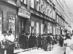Jews wait in line at the Margarethen police station for exit visas after Germany's annexation of Austria (the Anschluss). Vienna, Austria, March 1938.