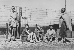 Emaciated survivors of the Buchenwald concentration camp soon after the liberation of the camp. [LCID: 78656]