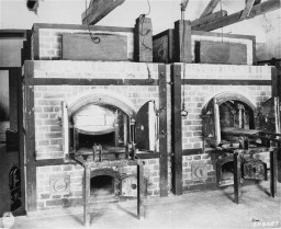 Two crematorium ovens sat side by side, set in brick.