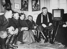 Germans listen to an antisemitic speech by Hitler. [LCID: 72139a]