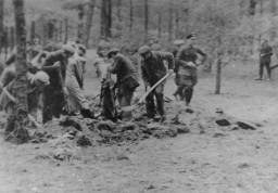 
Polish civilians under SS and Selbstschutz (ethnic German self-defense organization) guard are forced to dig a mass grave prior to their execution in the forest near Tuchola. Tuchola Forest, Bydgoszcz, Poland, October 27, 1939. 
