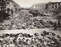German civilians remove the bodies of prisoners killed in the Nordhausen camp