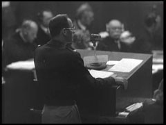 Lieutenant Colonel Baldwin of the US prosecution team presents the case against defendant Hans Frank at the Nuremberg trial. Baldwin refers to several of Frank's diary entries about the appropriation of scarce Polish grain for use as food in Germany.