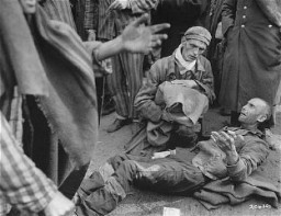 Survivors waiting for to be evacuated from the Wöbbelin concentration camp to receive medical attention at a field hospital. Germany, May 4, 1945.