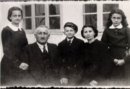 Lisa Nussbaum and her family. From left to right: Pola (sister), Herschel (father), Borushek (brother) Gittel (mother), and Lisa (about 13 years old in this photograph). Lisa's father exported geese to Germany for a living. Photograph taken in Raczki, Poland, ca. 1939.
With the end of World War II and collapse of the Nazi regime, survivors of the Holocaust faced the daunting task of rebuilding their lives. With little in the way of financial resources and few, if any, surviving family members, most eventually emigrated from Europe to start their lives again. Between 1945 and 1952, more than 80,000 Holocaust survivors immigrated to the United States. [ ] was one of them. 