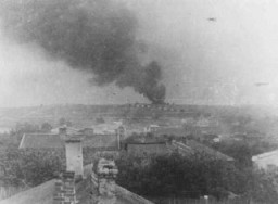 View of Majdanek camp from a nearby village. The smoke could be from the burning of corpses. Poland, October 1943.