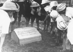 Polish Jewish refugee children known as the "Tehran Children" gather at a memorial stone dedicated to the Jewish refugees who died ... [LCID: 88540]